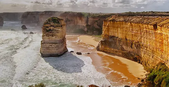 Waves crashing against the shore and cliffs