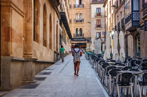 Woman walking in a street in Salamanca