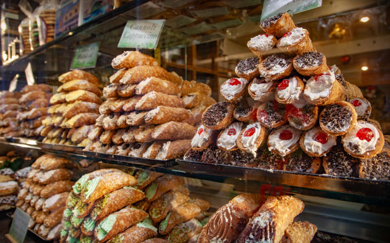 Sicily Guide Display of Cannoli in Shop Window
